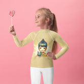 Child wearing CB6-36 rash guard for sun protection at the beach.